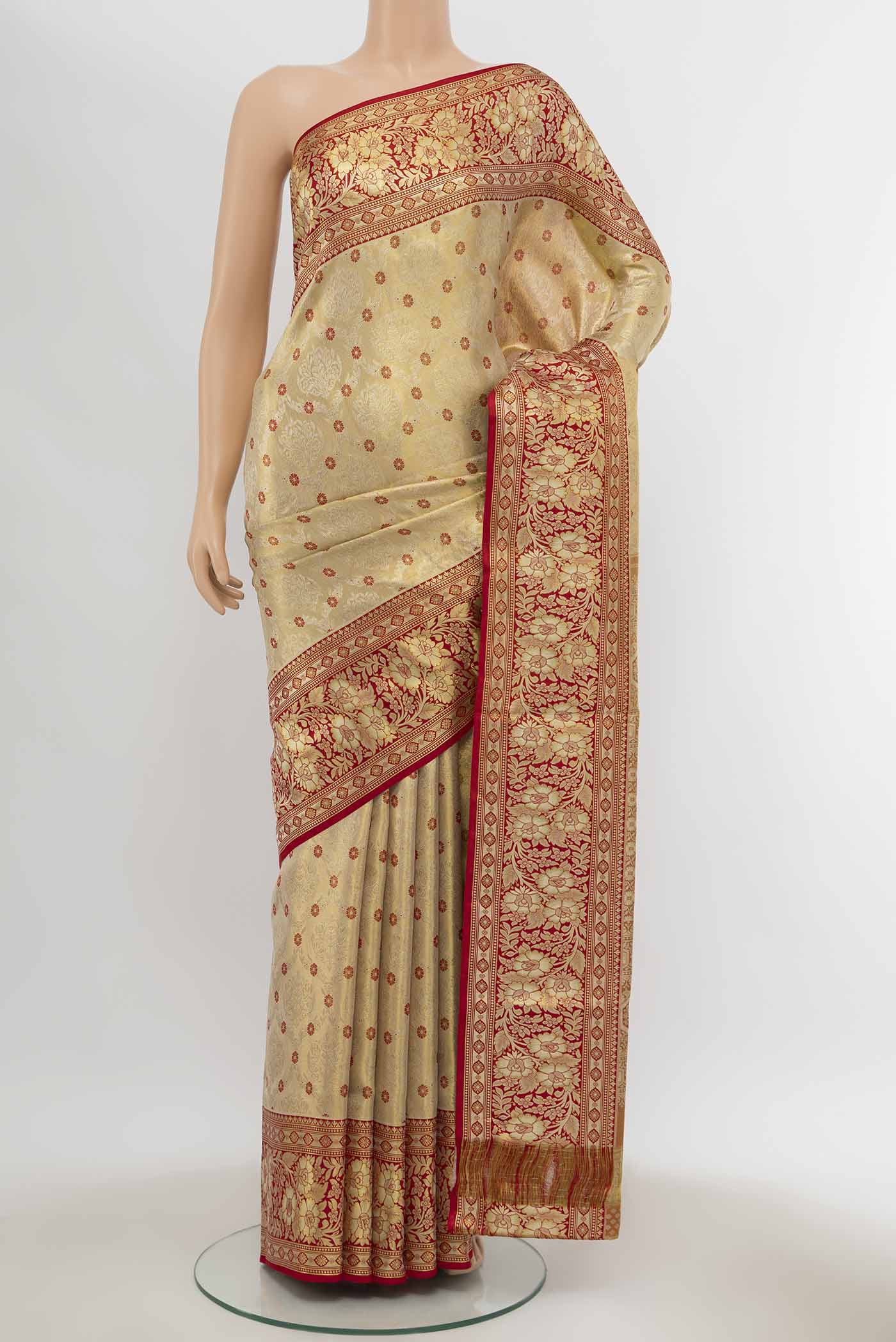 Gold Kanchipuram Tissue Silk Saree with Zari Brocade on the body and Zari Border displayed on a mannequin