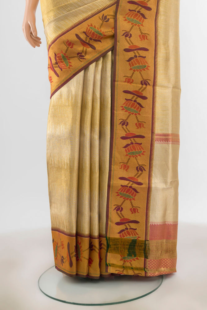 Pleats and pallu of Golden Kanchipuram Silk Saree with Zari Butta on the body and Silk Border. 