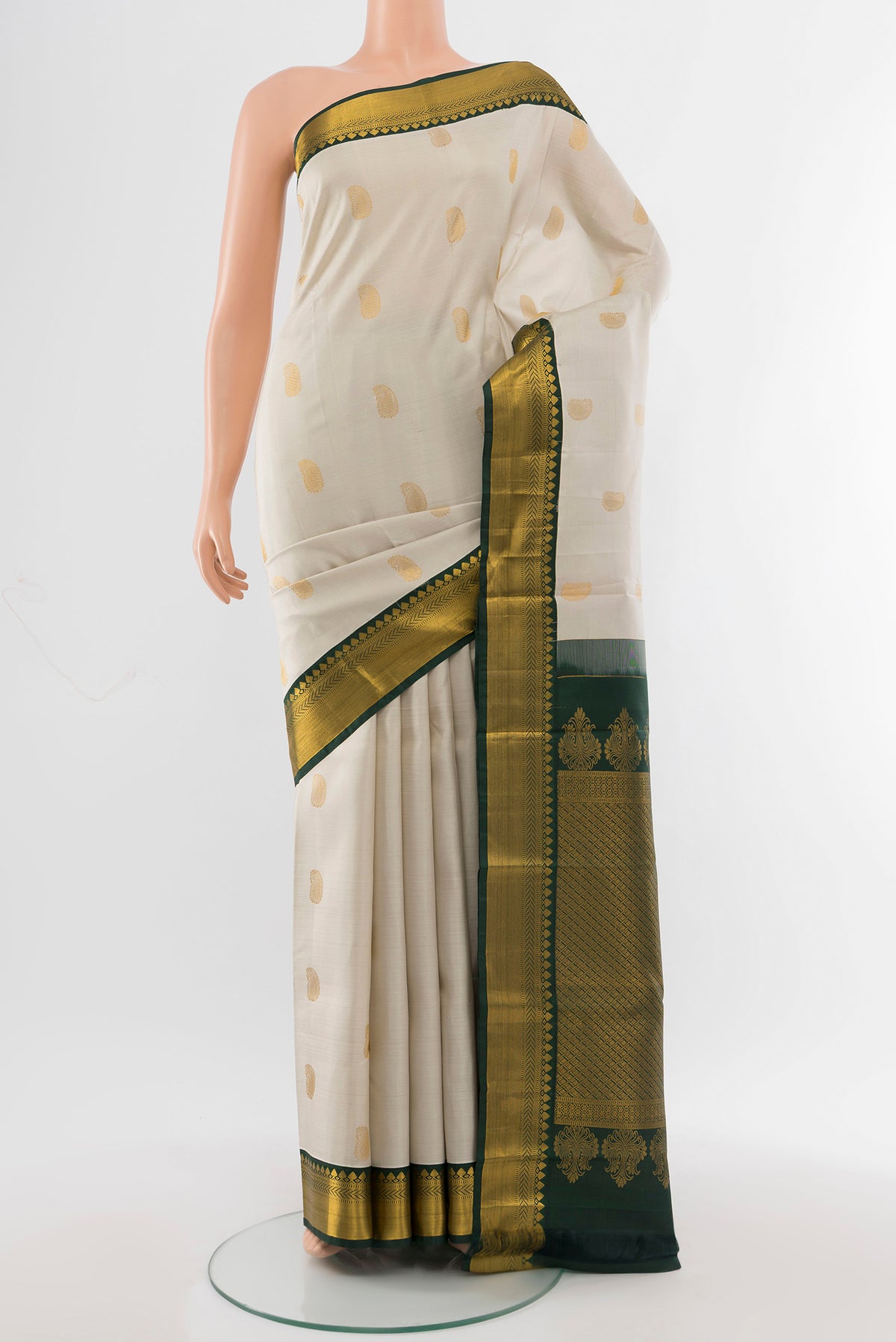 Pure Silk Pure Zari Cream Kanchipuram Saree with Zari Butta on the body and Silk Border.  displayed on a mannequin