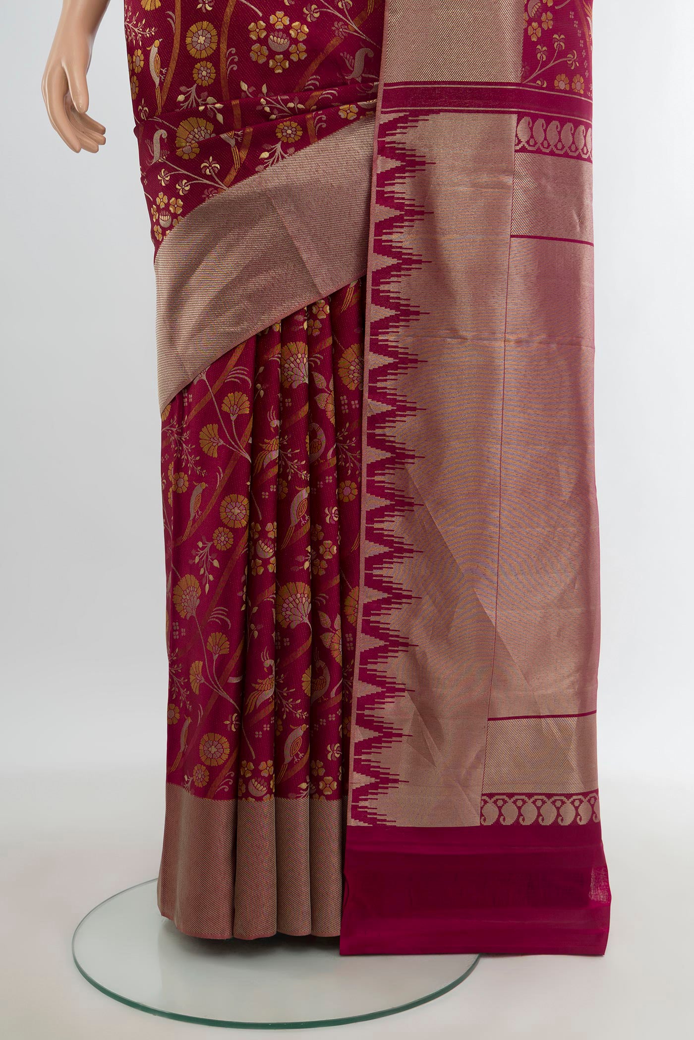Pleats and pallu of Magenta Kanjivaram Silk Saree with Zari And Thread Butta on the body and Zari Border. 