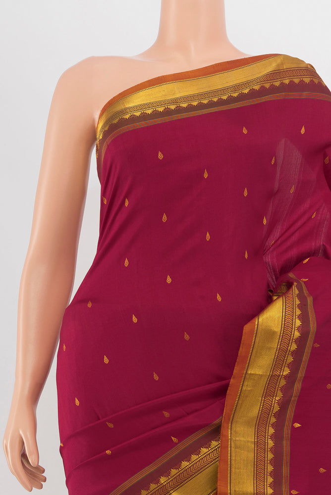 Border image of Maroon Kanchipuram Silk Saree with Zari Butta on the body and Silk Border. 
