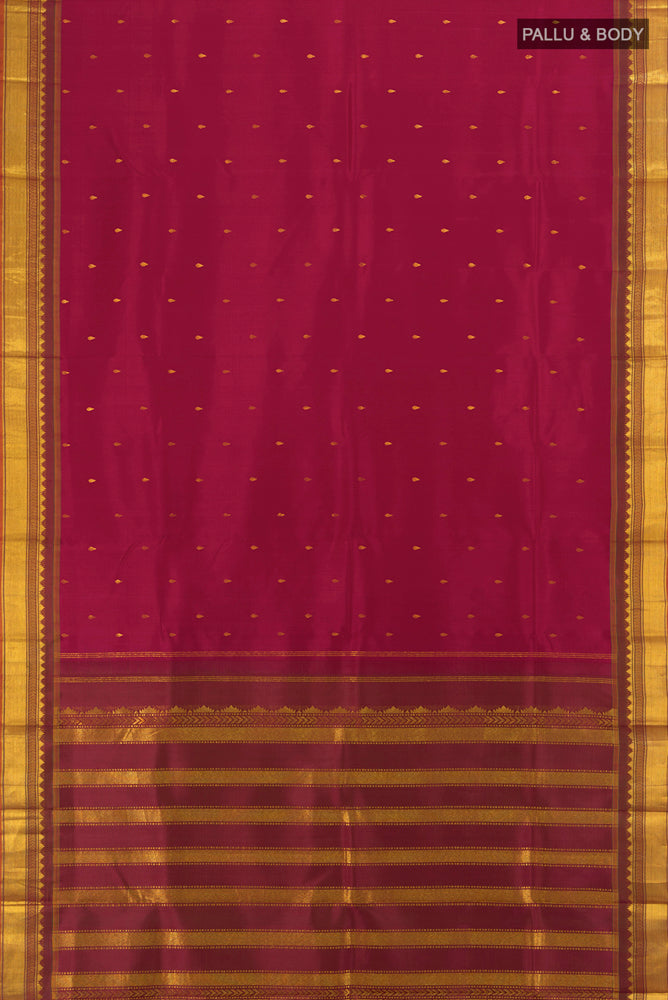 Flat view of Maroon Kanchipuram Silk Saree with Zari Butta on the body and Silk Border. 