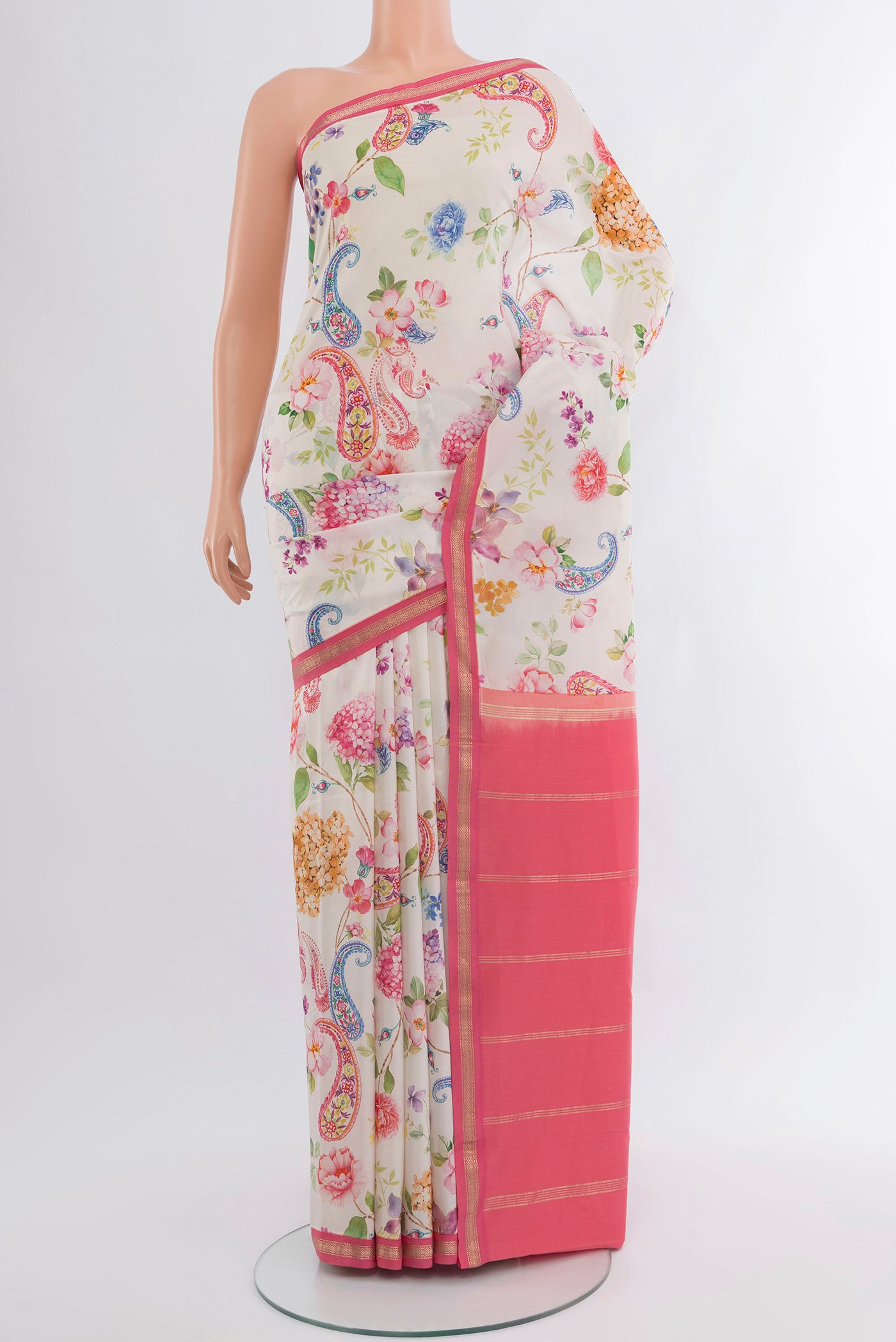 Off White Printed Silk Saree with Floral Print on the body and Zari Border.  displayed on a mannequin