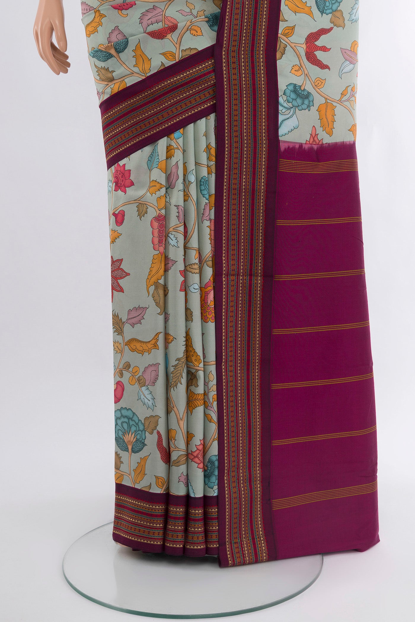 Pleats and pallu of Grey Printed Silk Saree with Floral Print on the body and Zari Border. 
