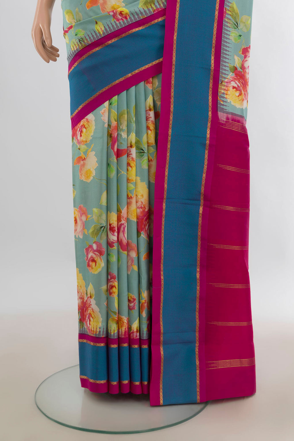 Pleats and pallu of Pure Silk Mint Green Printed Saree with Floral Print on the body and Plain Border. 