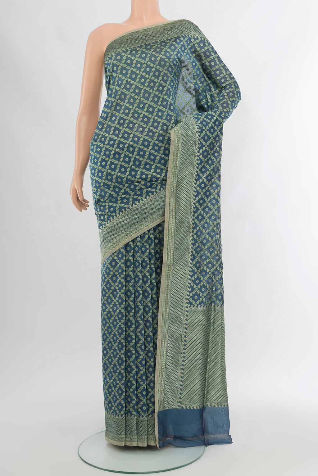 Blue Grey Banarasi Silk Saree with Floral Print on the body and Zari Border.  displayed on a mannequin