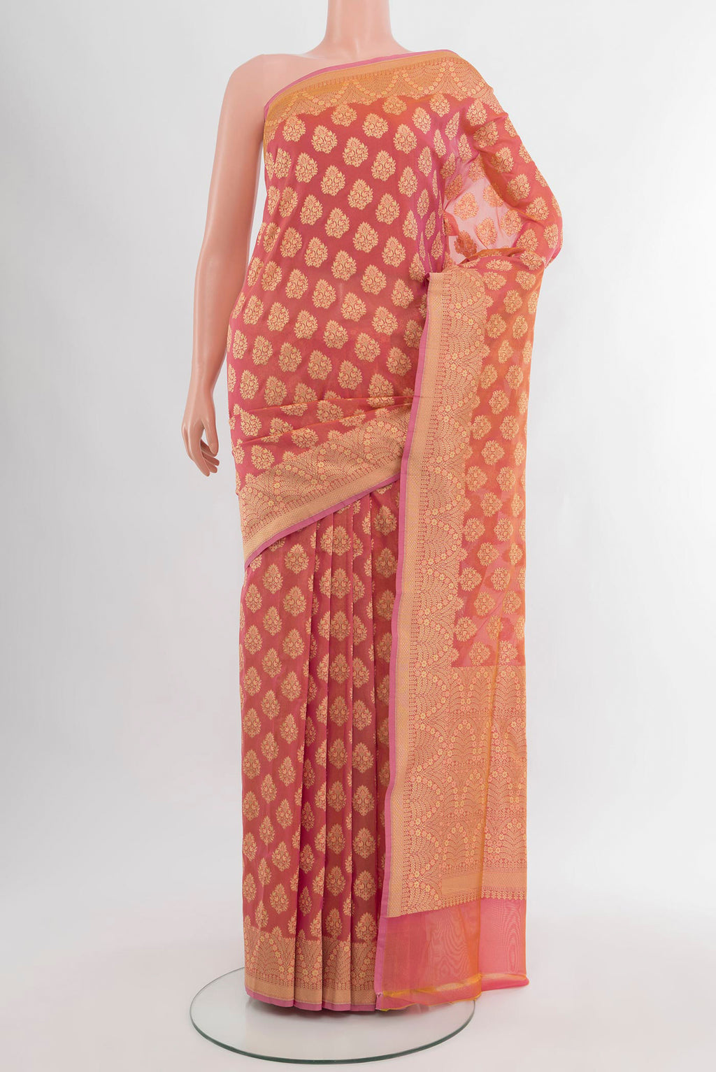 Coral Banarasi Silk Saree with Zari Butta on the body and Zari Border.  displayed on a mannequin