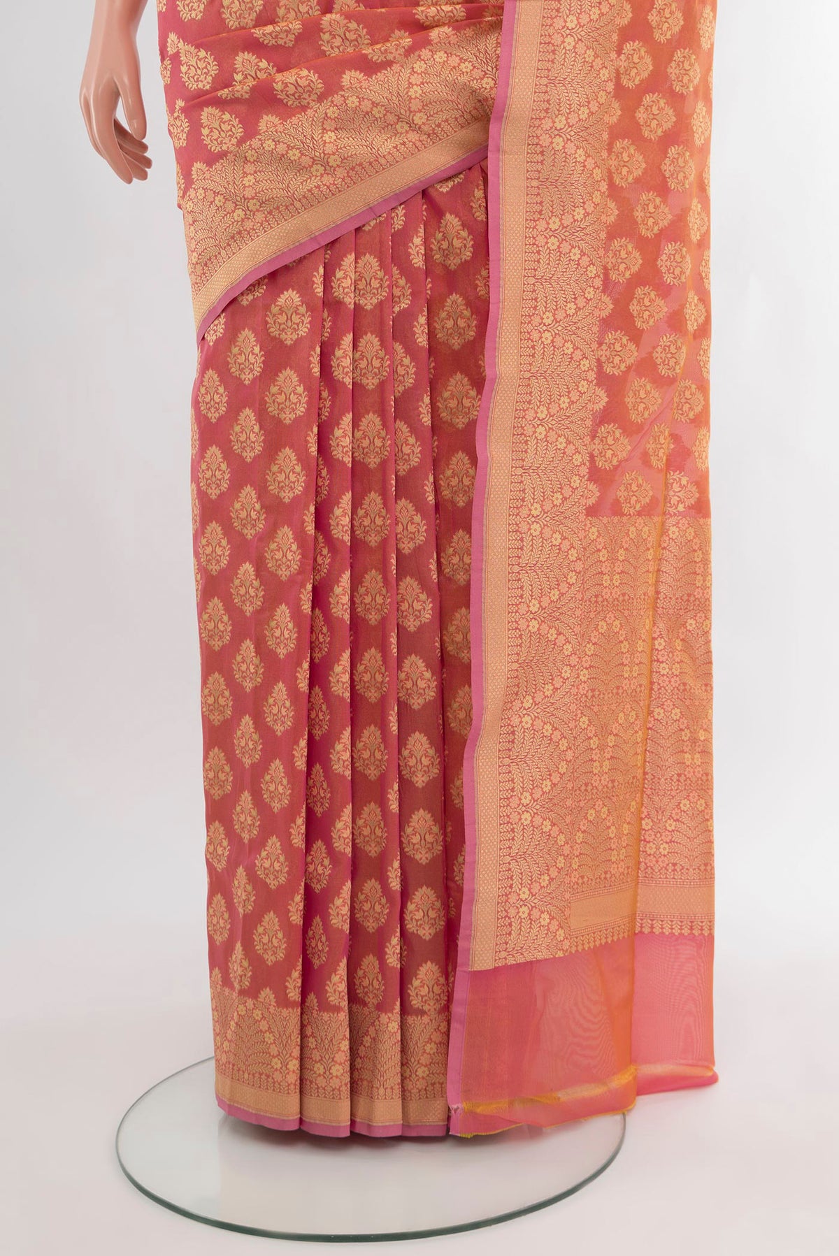 Pleats and pallu of Coral Banarasi Silk Saree with Zari Butta on the body and Zari Border. 