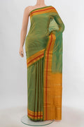 Parrot Green Narayanpet Silk Saree with Zari Butta on the body and Silk Border.  displayed on a mannequin
