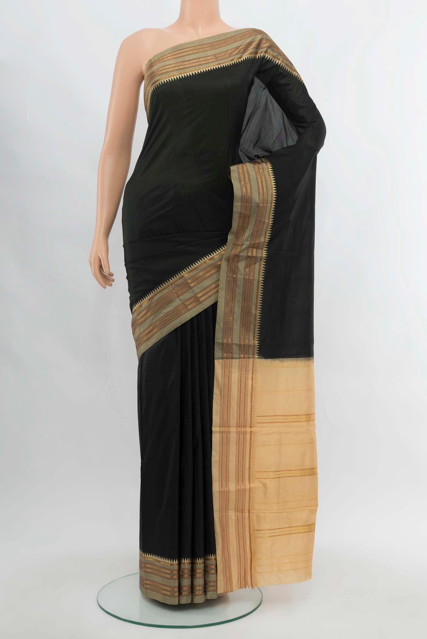 Black Narayanpet Silk Saree with Zari Butta on the body and Silk Border.  displayed on a mannequin