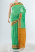 Pure Silk Pure Zari Light Green Narayanpet Saree with Plain Body and Silk Border.  displayed on a mannequin