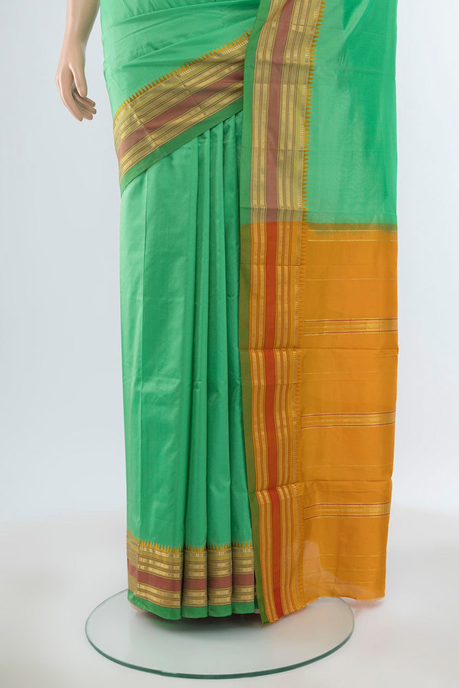 Pleats and pallu of Pure Silk Pure Zari Light Green Narayanpet Saree with Plain Body and Silk Border. 