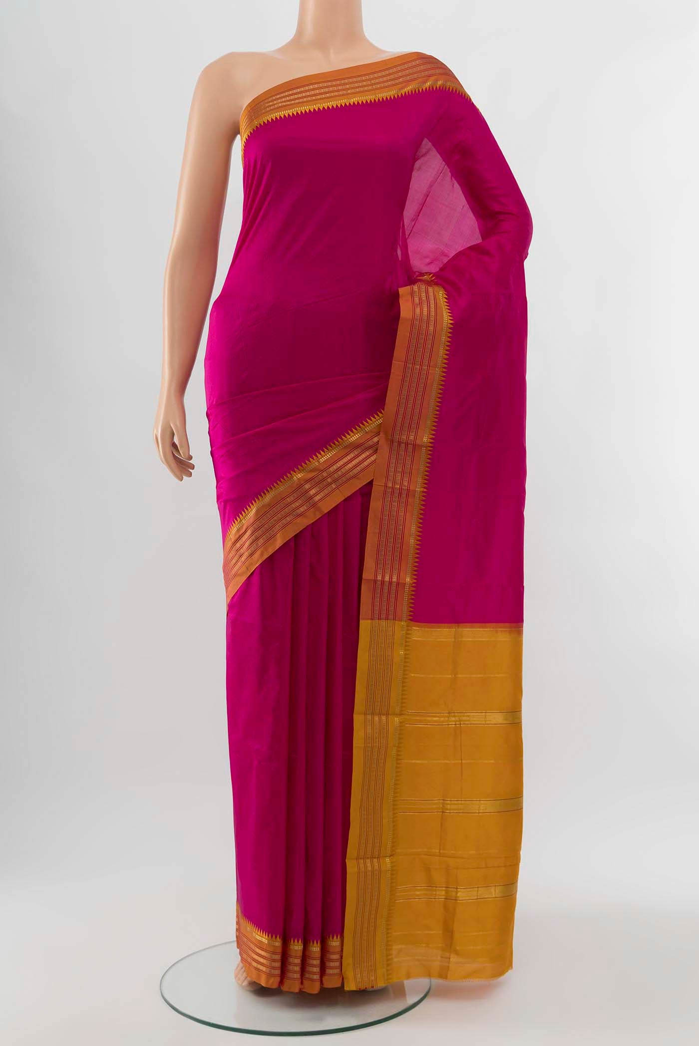 Magenta Narayanpet Silk Saree with Zari Brocade on the body and Silk Border displayed on a mannequin