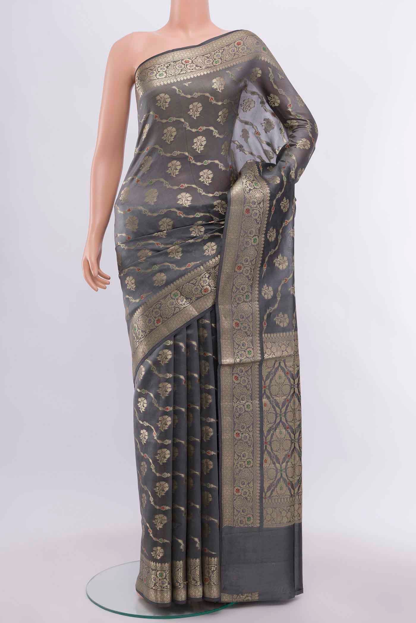 Grey Banarasi Raw Silk Saree with Zari Butta on the body and Silk Border displayed on a mannequin