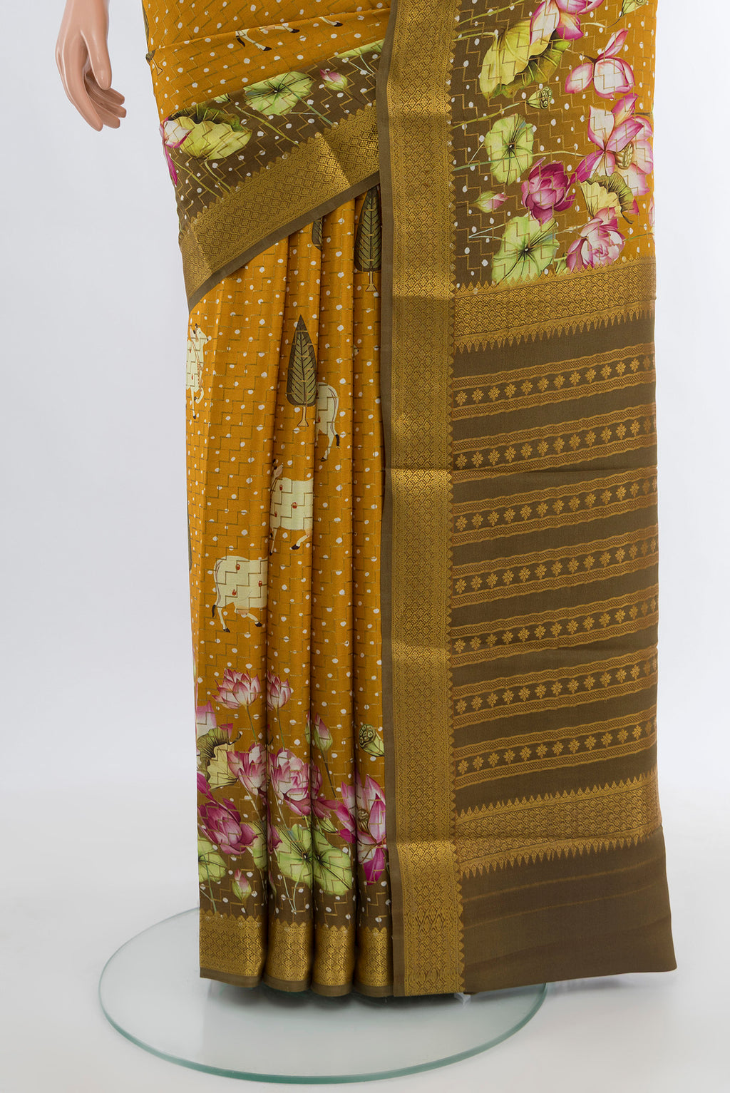 Pleats and pallu of Mustard Mysore Crepe Saree with Floral Print on the body and Zari Border. 
