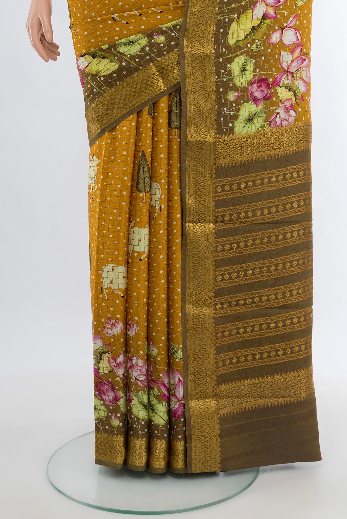 Pleats and pallu of Mustard Mysore Crepe Saree with Floral Print on the body and Zari Border. 