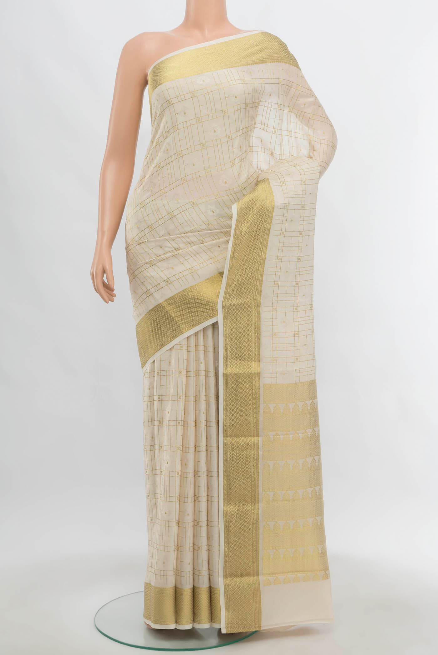 Cream Mysore Crepe Saree with Zari Butta on the body and Zari Border.  displayed on a mannequin