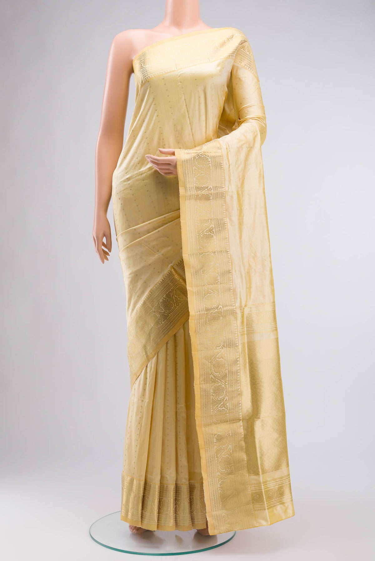Beige Bangalore Silk Saree with Zari Butta on the body and Zari Border displayed on a mannequin