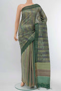Light Green Tussar Silk Saree with Floral Print on the body and Zari Border displayed on a mannequin