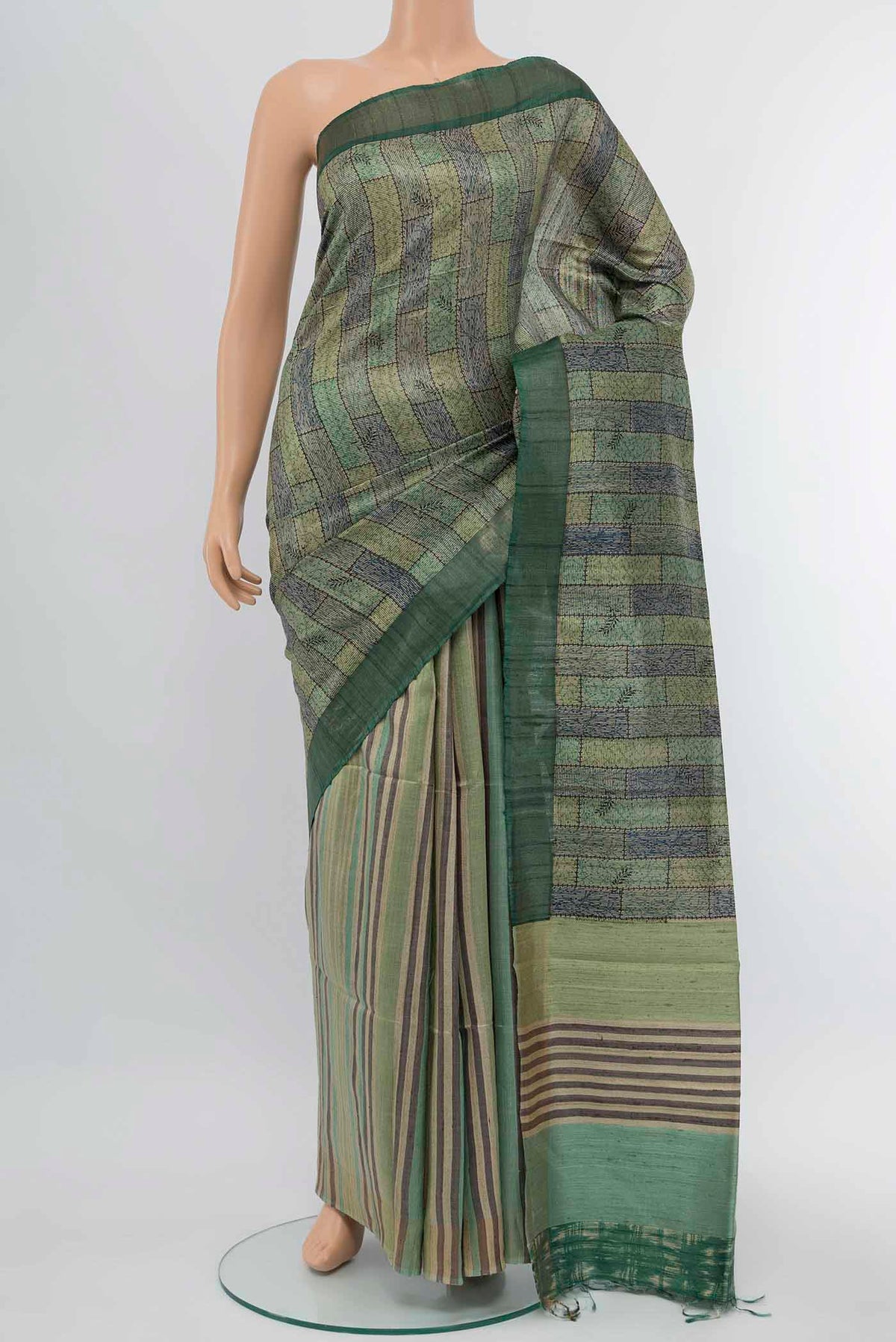 Light Green Tussar Silk Saree with Floral Print on the body and Zari Border displayed on a mannequin