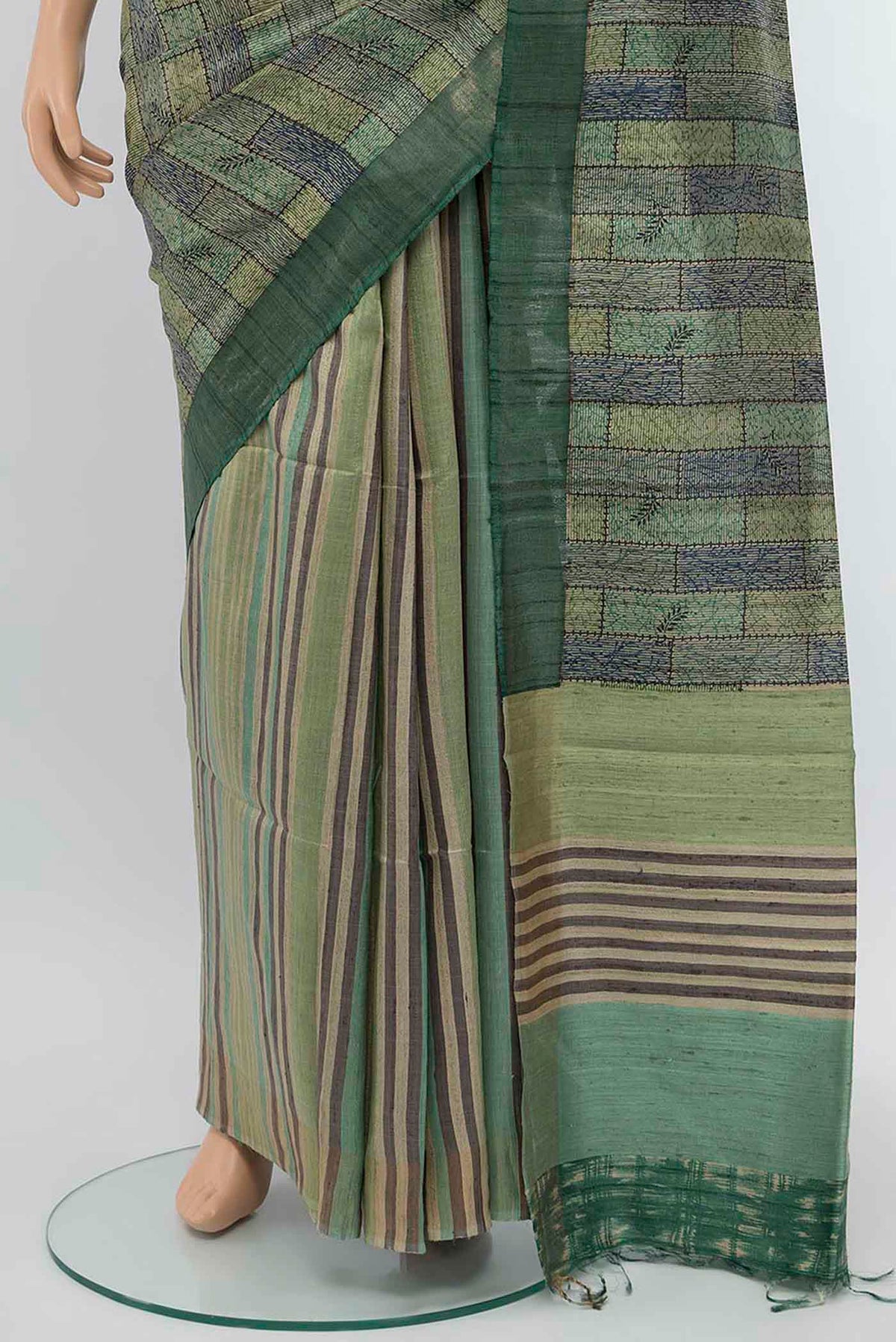 Pleats and pallu of Light Green Tussar Silk Saree with Floral Print on the body and Zari Border