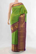 Parrot Green Kanchipuram Silk Saree with Zari Butta on the body and Silk Border displayed on a mannequin