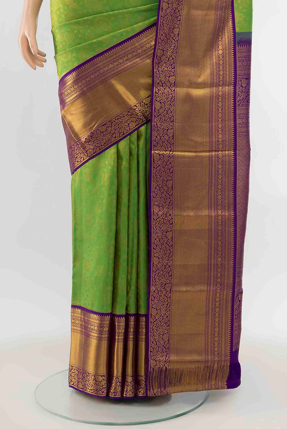 Pleats and pallu of Parrot Green Kanchipuram Silk Saree with Zari Butta on the body and Silk Border
