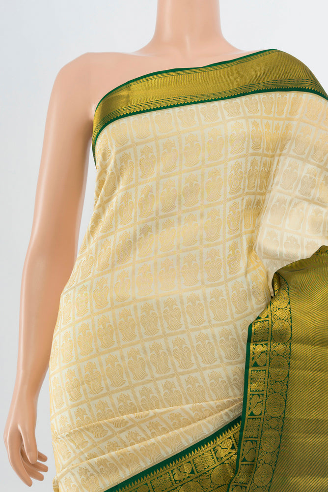 Border image of Golden Kanchipuram Silk Saree with Zari Butta on the body and Silk Border. 