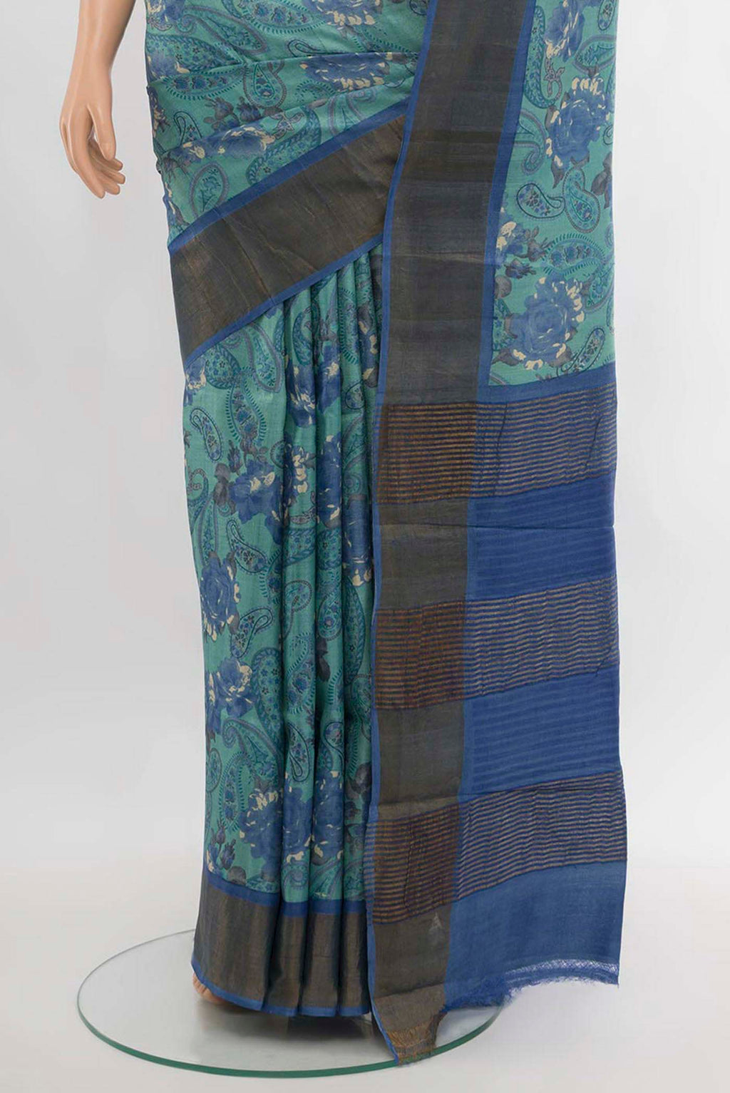Pleats and pallu of Sky Blue Tussar Silk Saree with Floral Print on the body and Silk Border. 