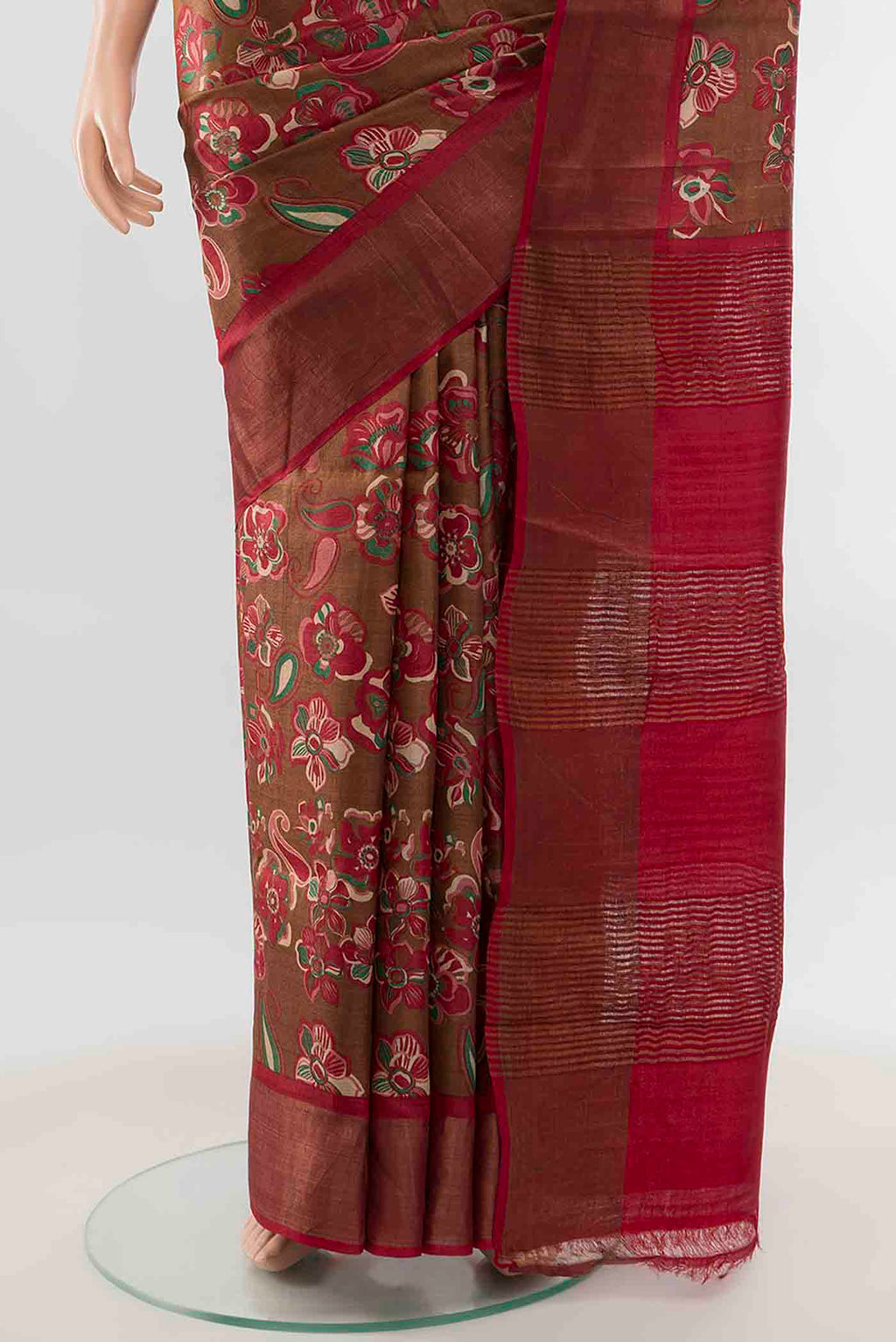 Pleats and pallu of Brown Tussar Silk Saree with Zari Butta on the body and Silk Border