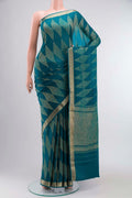 Teal Mysore Georgette Saree with Zari Butta on the body and Zari Border displayed on a mannequin