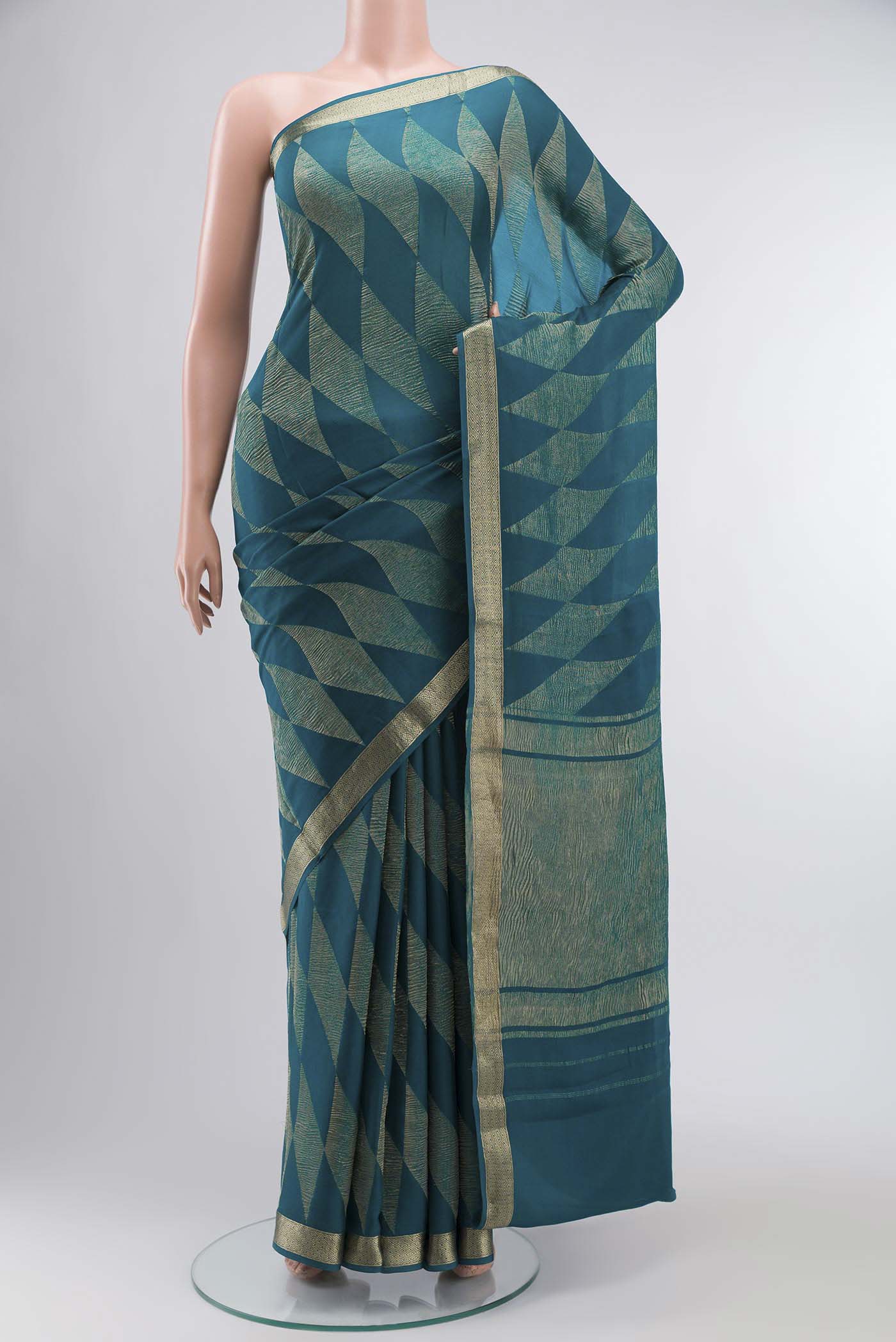 Teal Mysore Georgette Saree with Zari Butta on the body and Zari Border displayed on a mannequin