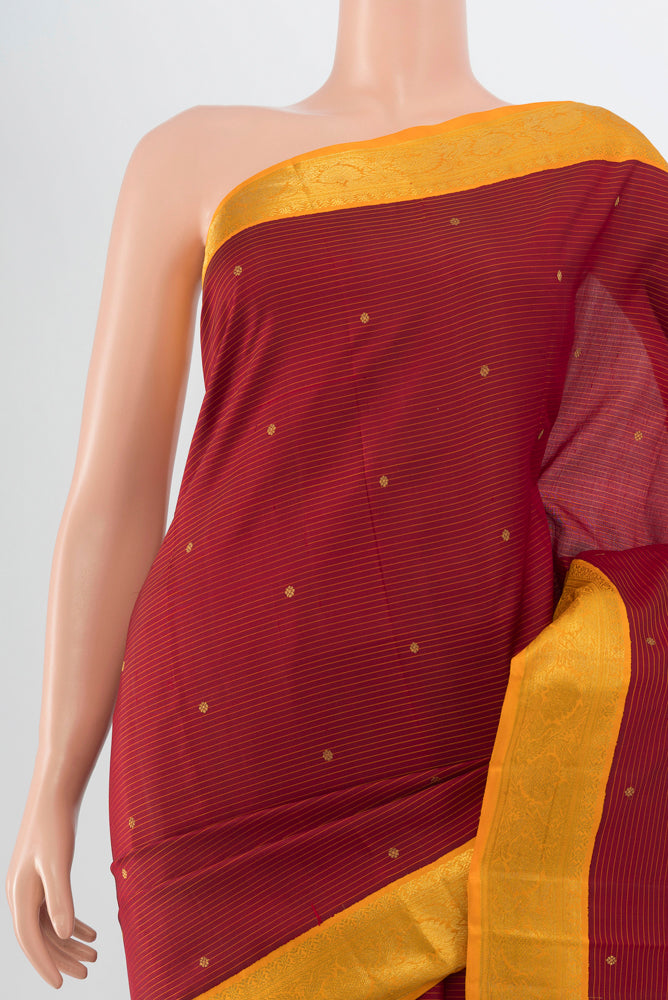 Border image of Maroon Kanchipuram Silk Saree with Zari Butta on the body and Silk Border. 