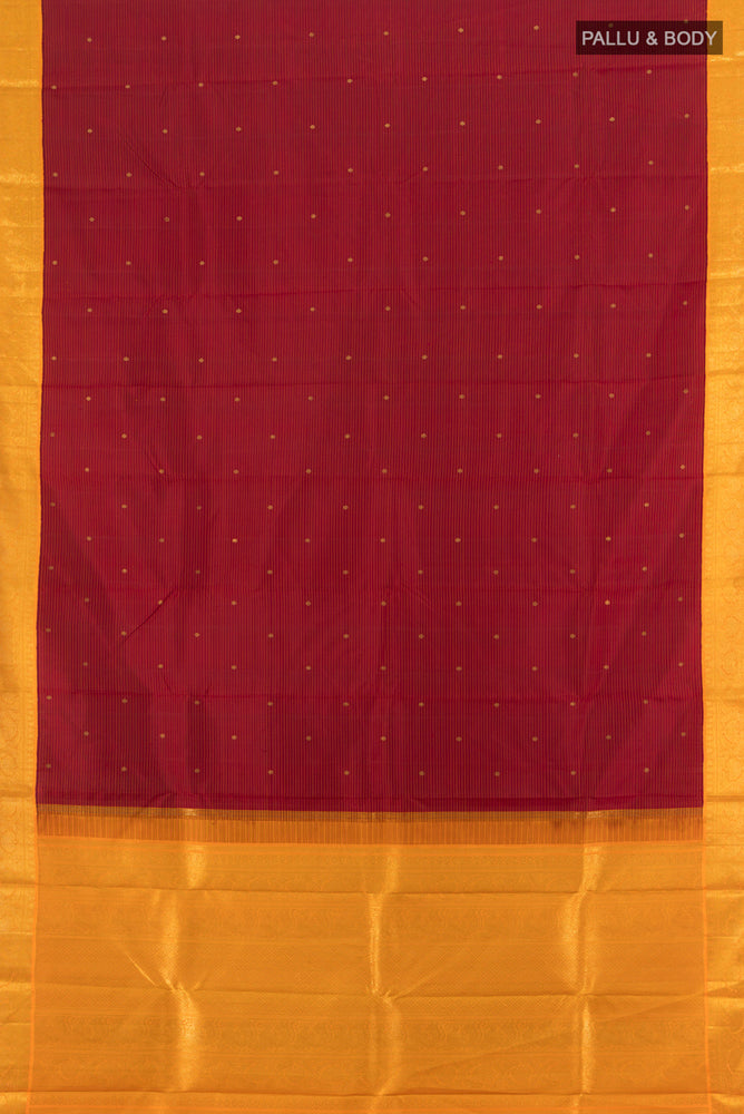 Flat view of Maroon Kanchipuram Silk Saree with Zari Butta on the body and Silk Border. 