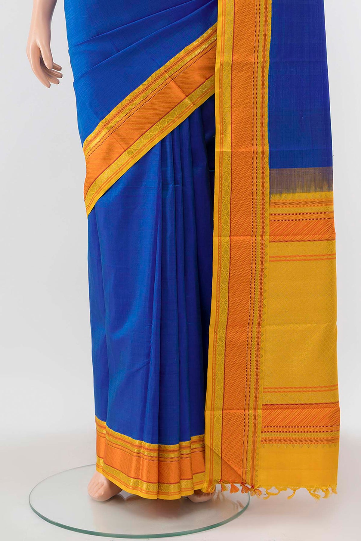 Pleats and pallu of Blue Kanchipuram Silk Saree with Zari Butta on the body and Silk Border