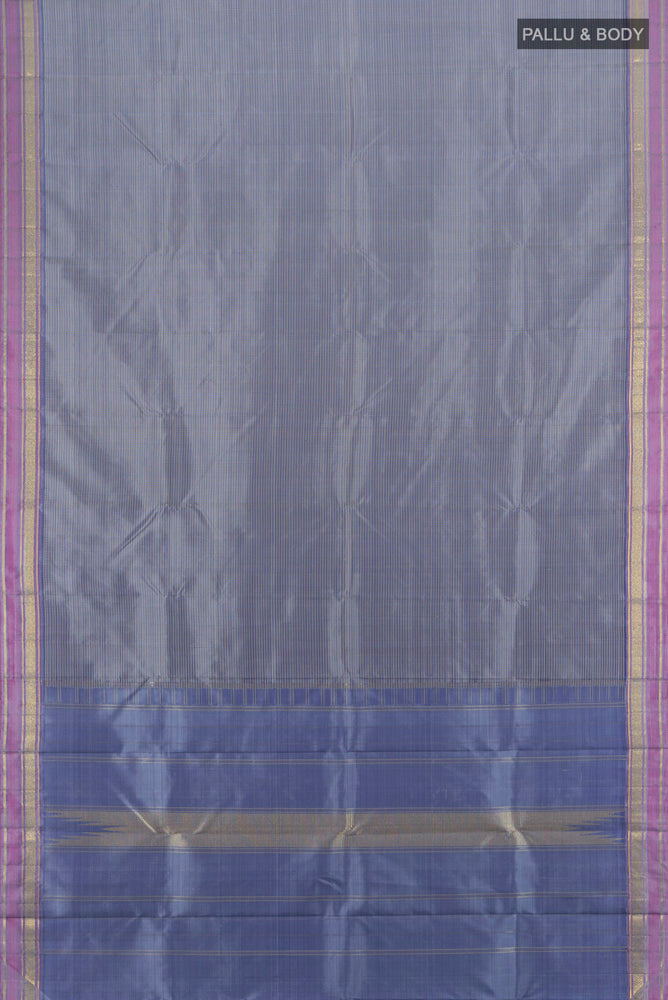 Flat view of Davys Grey Kanjivaram Silk Saree with Zari Butta on the body and Silk Border. 