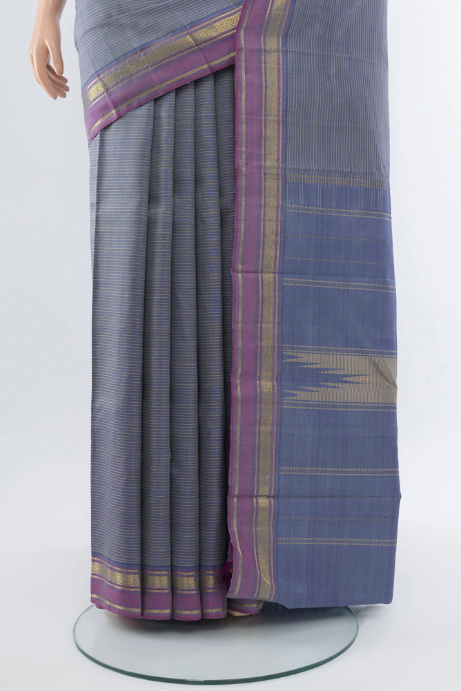 Pleats and pallu of Davys Grey Kanjivaram Silk Saree with Zari Butta on the body and Silk Border. 