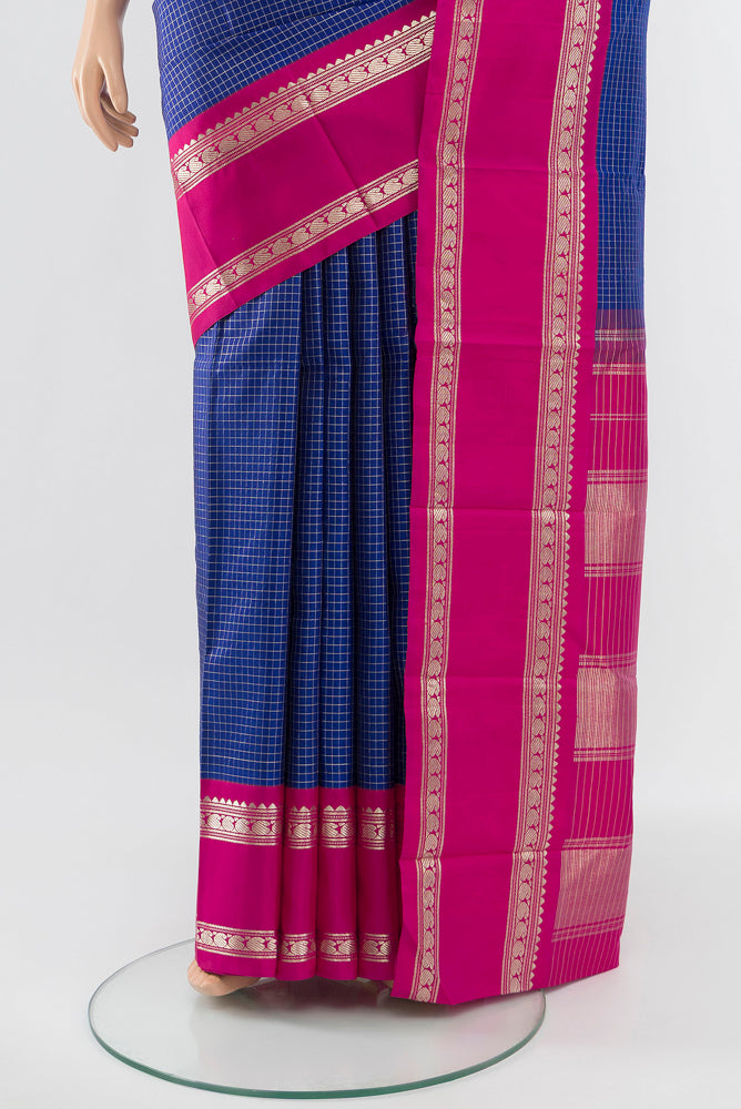 Pleats and pallu of Dark Blue Kanjivaram Silk Saree with Zari Butta on the body and Silk Border. 