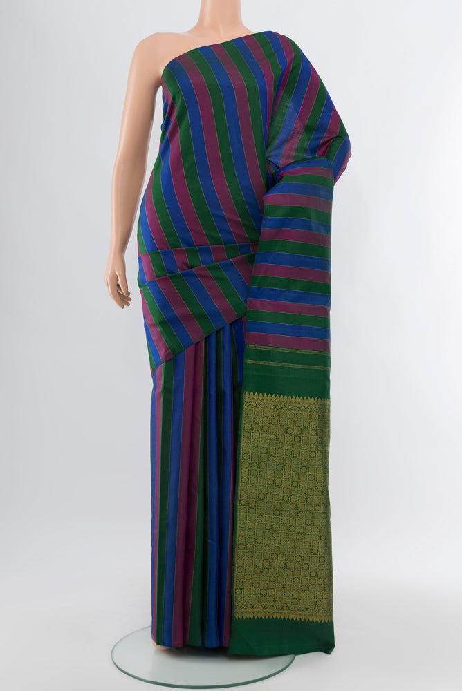 Multi Color Kanjivaram Silk Saree with Zari Butta on the body and Silk Border.  displayed on a mannequin