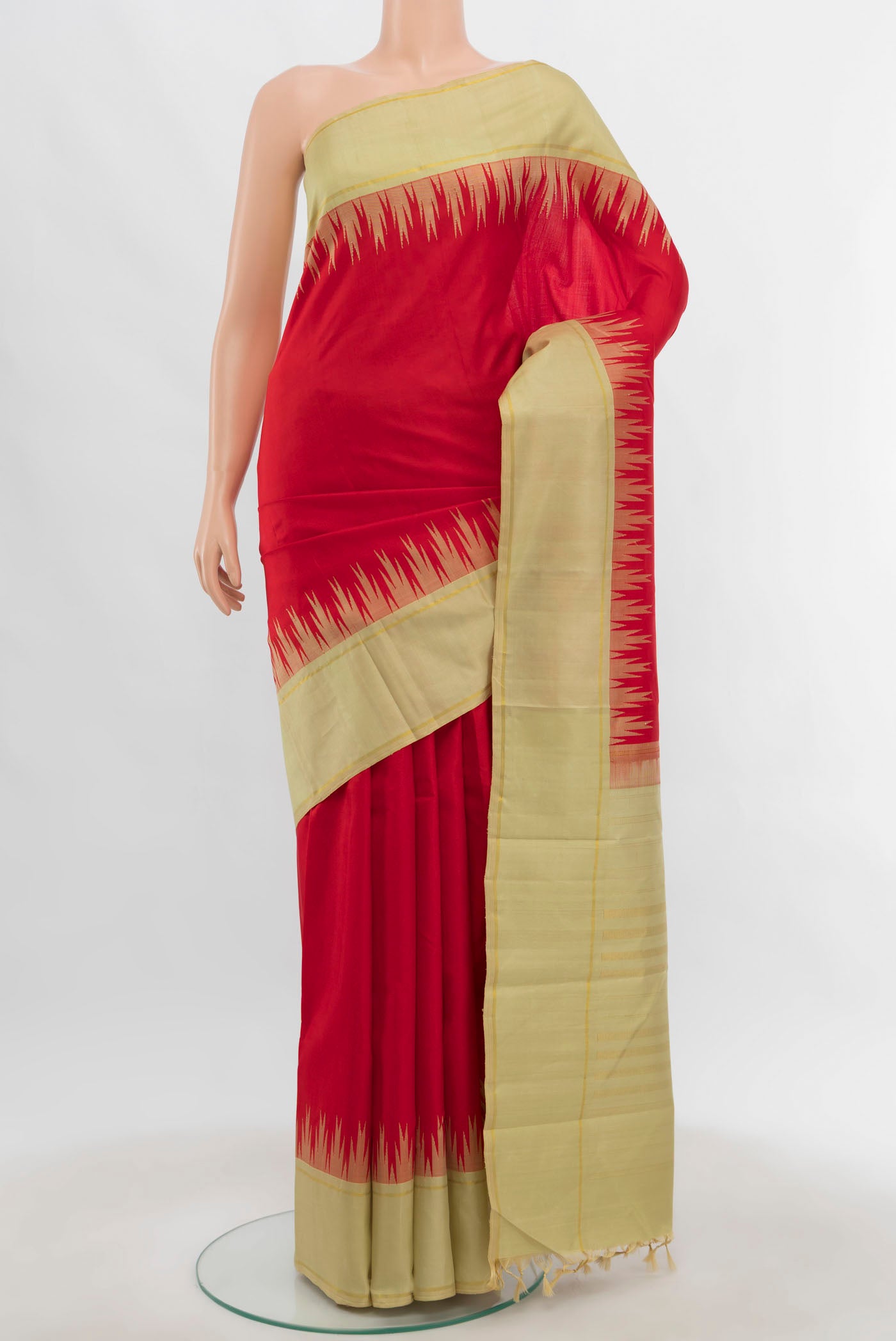 Red Kanjivaram Silk Saree with Zari Butta on the body and Zari Border.  displayed on a mannequin