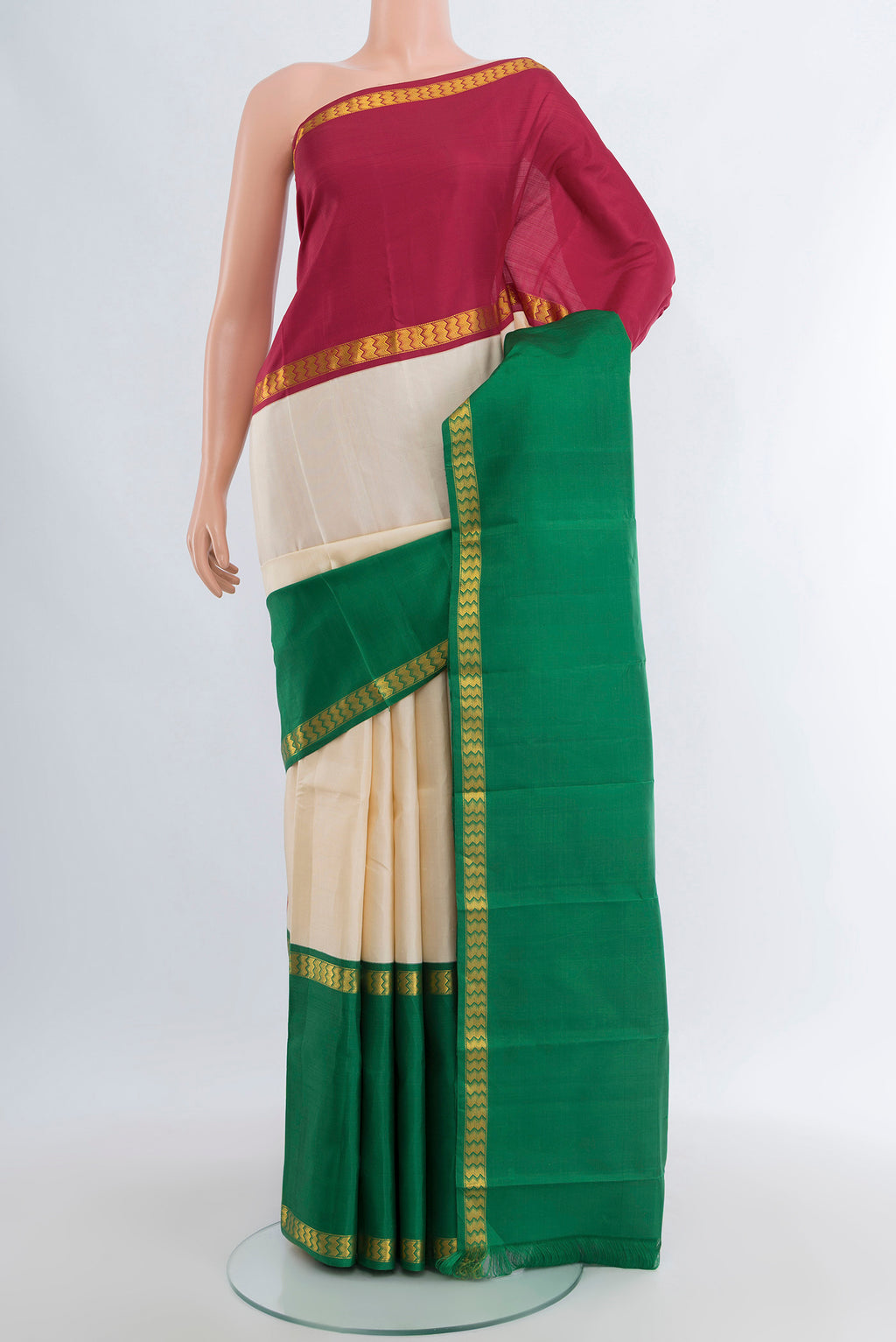 Cream Kanjivaram Silk Saree with Plain Body and Ganga Jamuna Border.  displayed on a mannequin