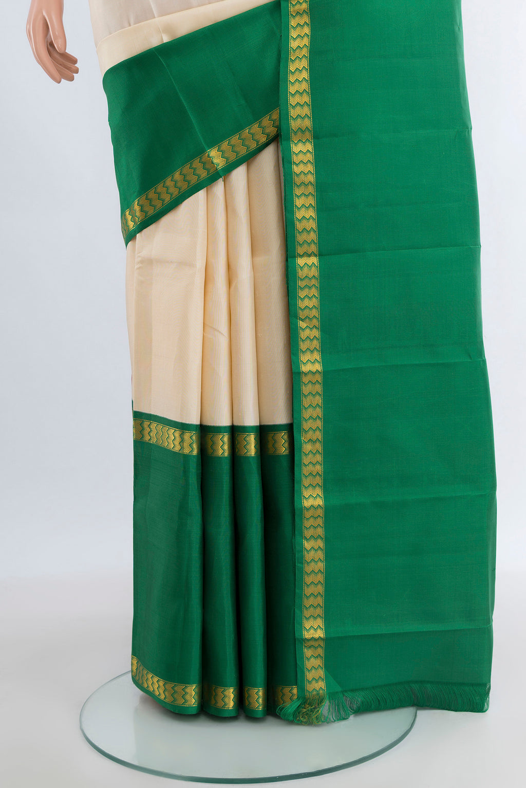 Pleats and pallu of Cream Kanjivaram Silk Saree with Plain Body and Ganga Jamuna Border. 
