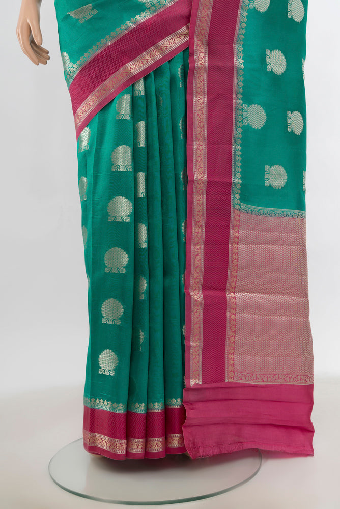 Pleats and pallu of Light Blue Tussar Silk Saree with Zari Butta on the body and Silk Border. 