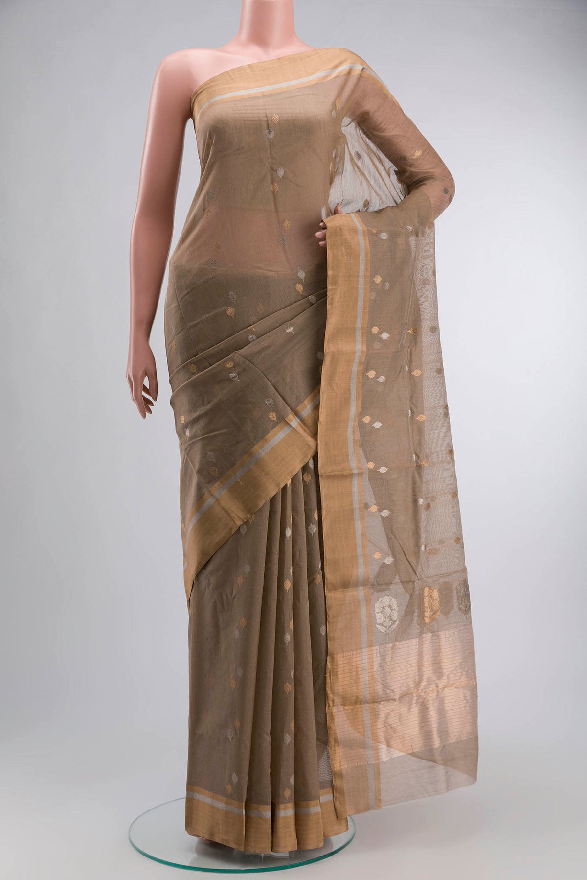 Beige Chanderi Silk Cotton Saree with Zari Butta on the body and Zari Border displayed on a mannequin