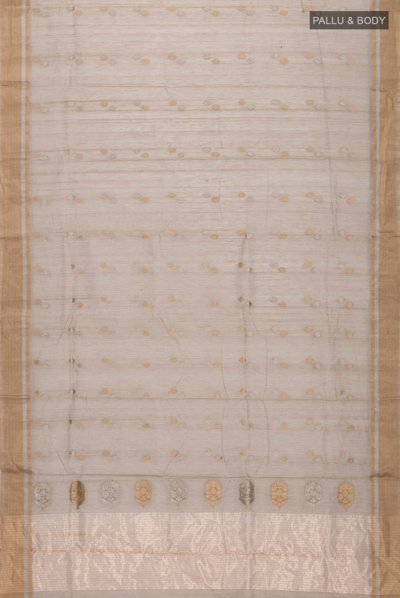 Flat view of Beige Chanderi Silk Cotton Saree with Zari Butta on the body and Zari Border