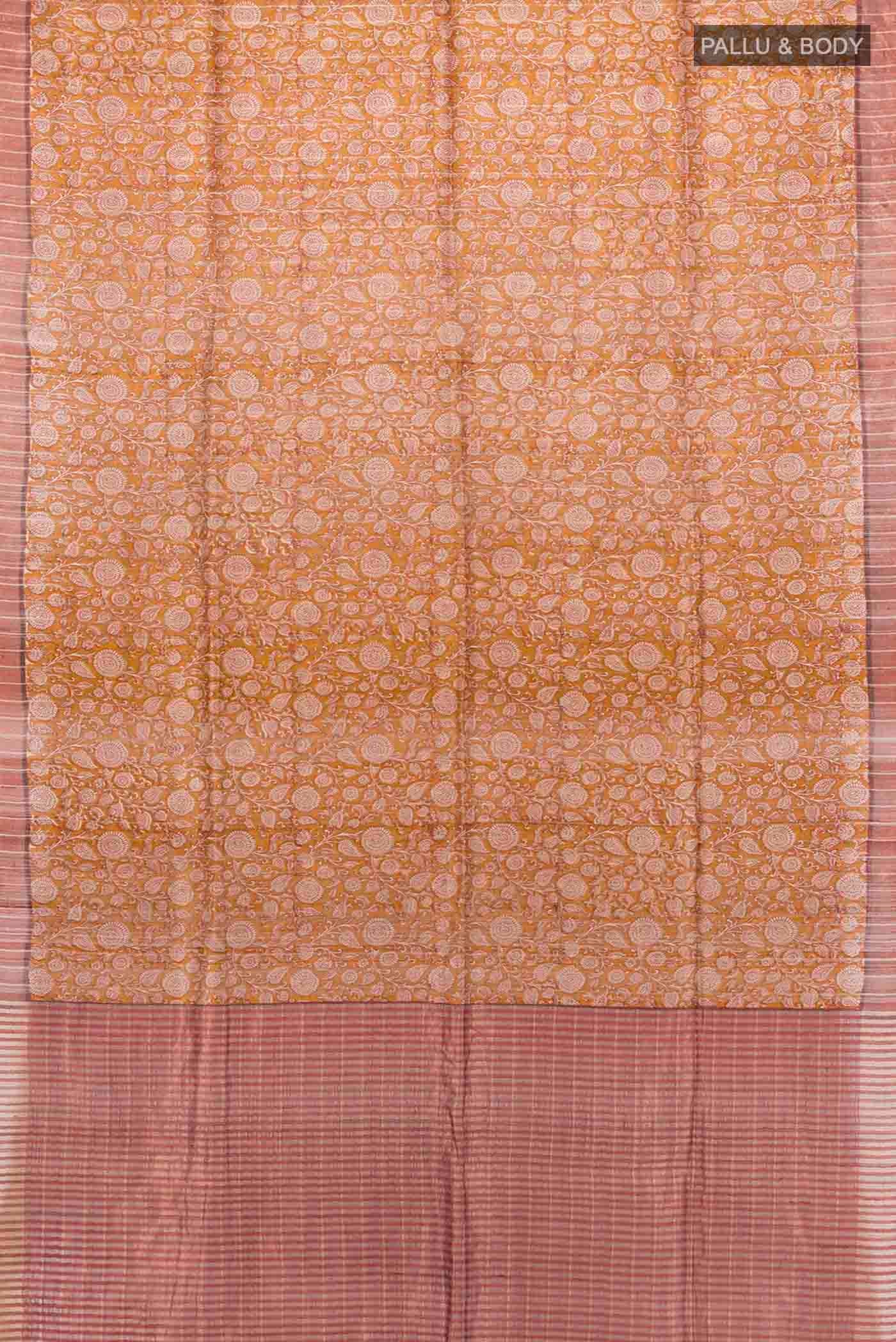 Flat view of Mustard Tussar Silk Saree with Floral Print on the body and Zari Border