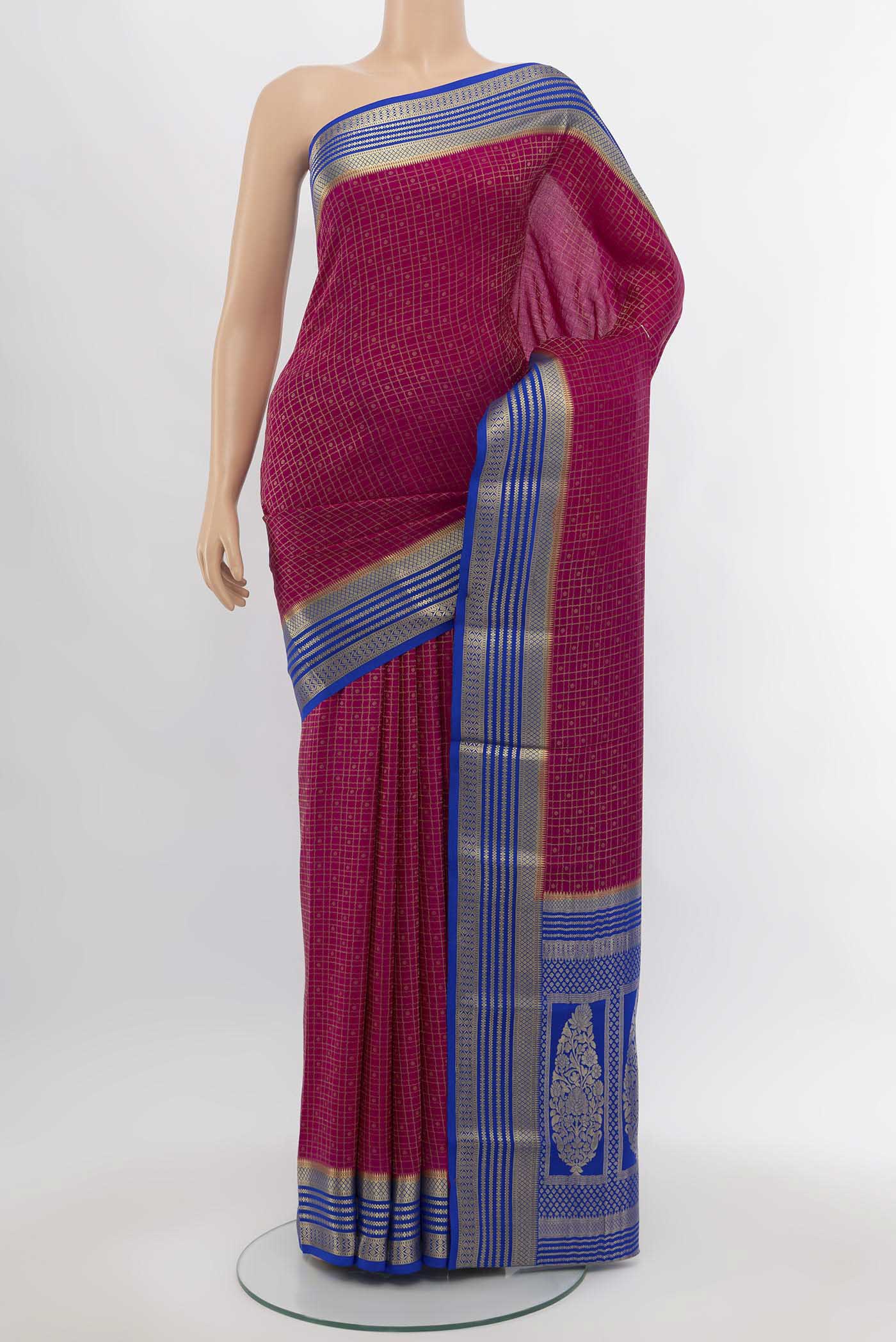 Magenta Mysore Crepe Saree with Zari Butta on the body and Silk Border.  displayed on a mannequin