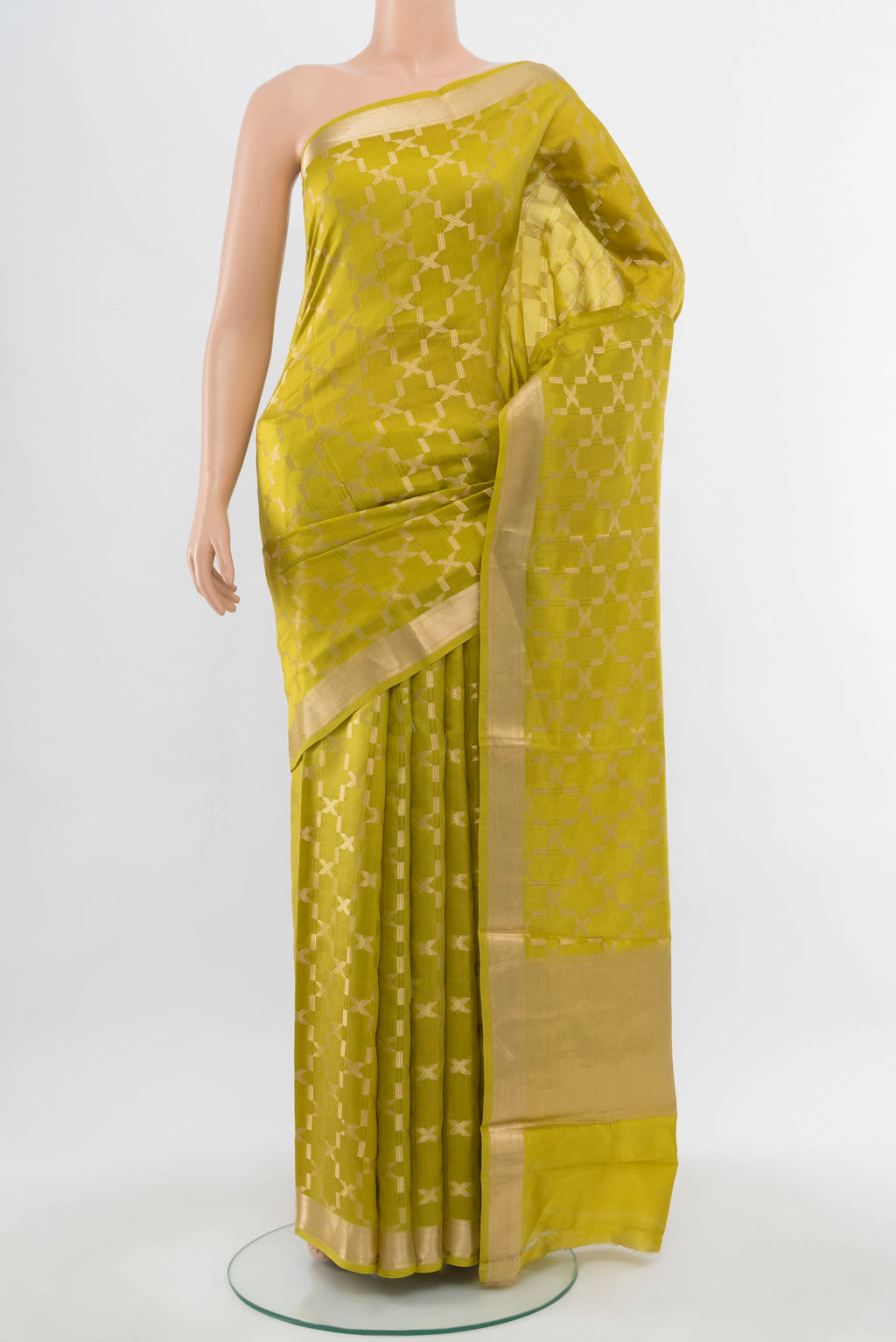 Light Green Banarasi Katan Silk Saree with Zari Butta on the body and Silk Border.  displayed on a mannequin