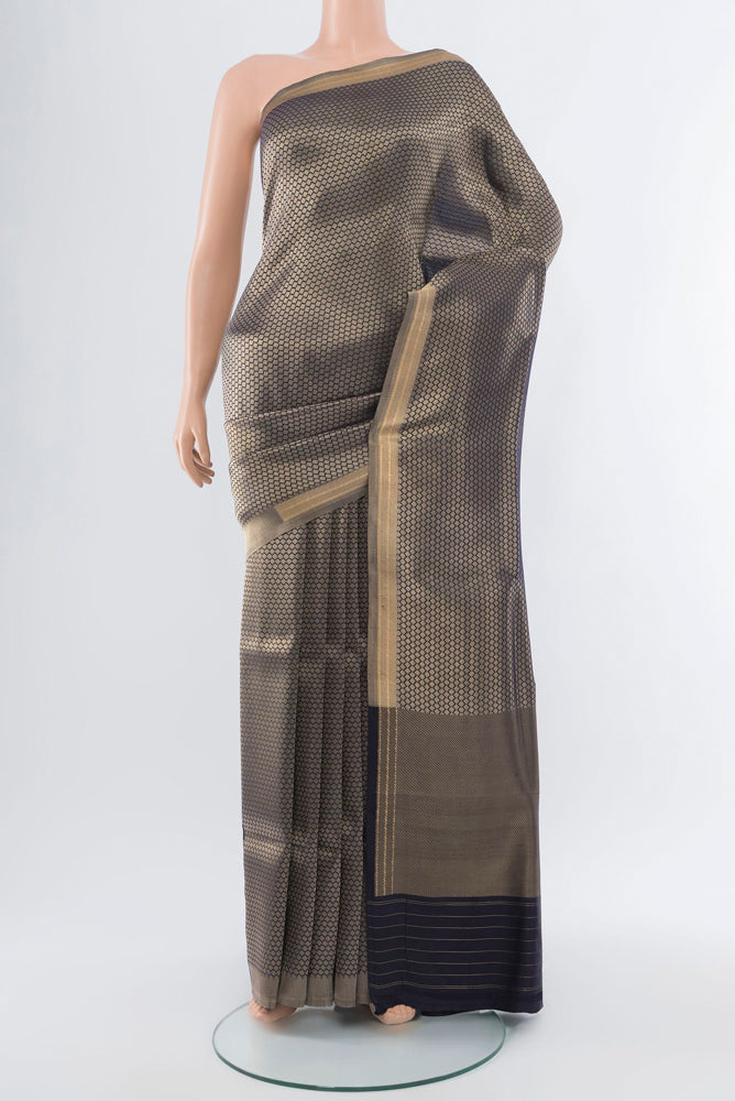 Navy Blue Banarasi Katan Silk Saree with Zari Butta on the body and Silk Border.  displayed on a mannequin