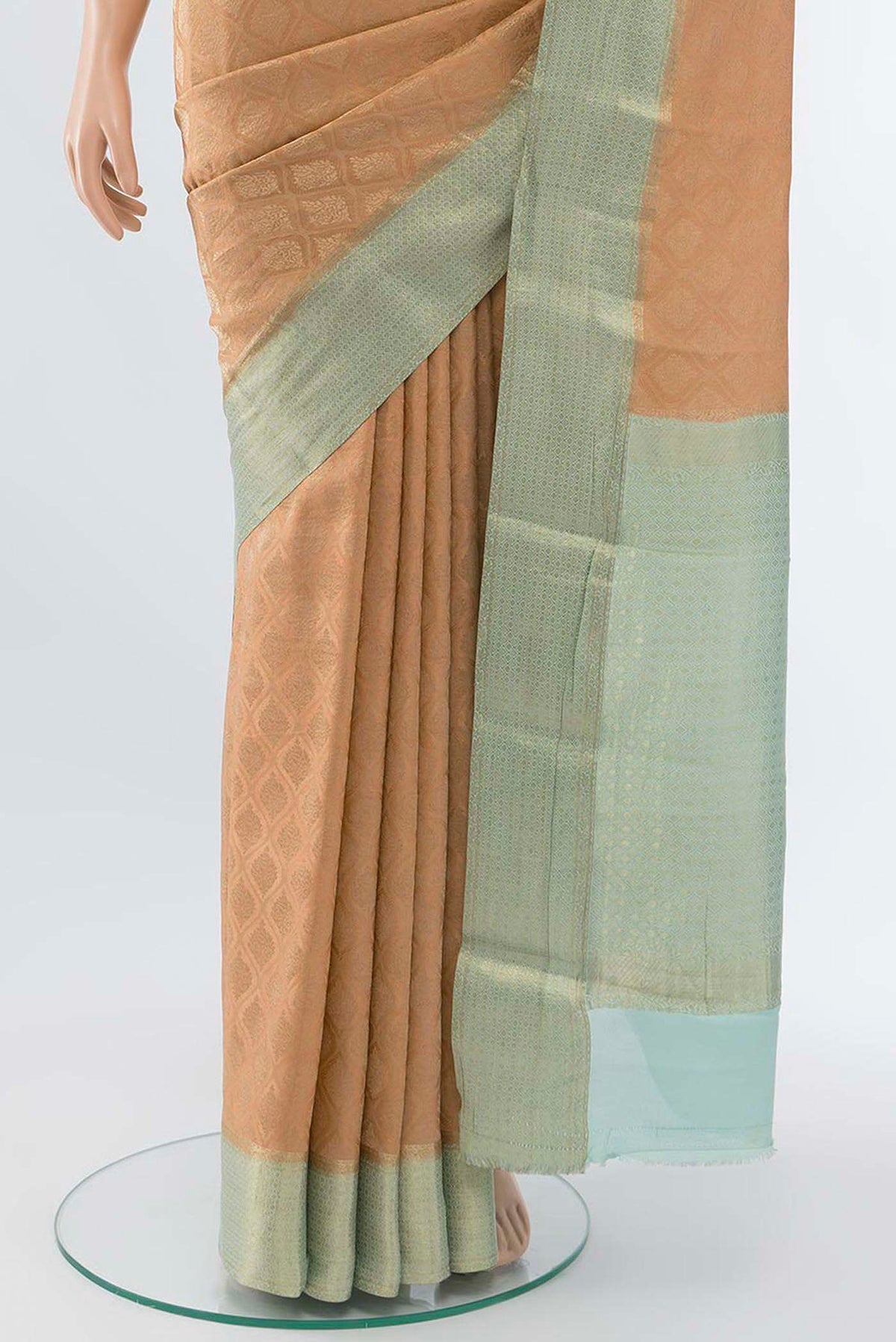 Pleats and pallu of Peach Mysore Crepe Saree with Zari Butta on the body and Fancy Border